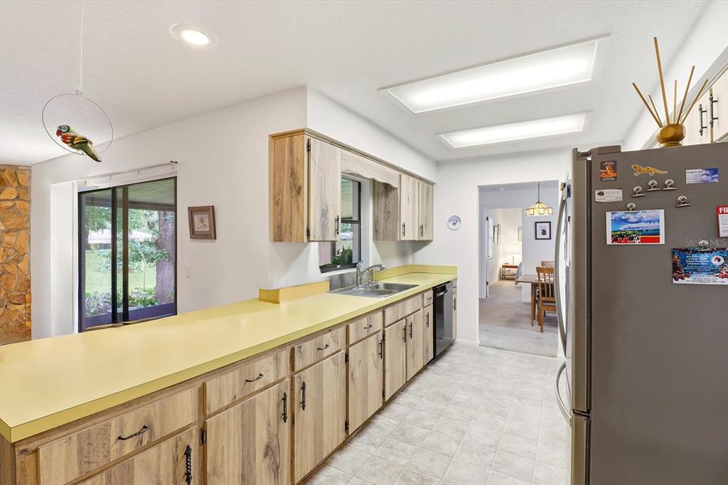 3103 South Bay Berry Point Inverness, FL 34450 - Photo 23 of 50 a spacious bathroom with a sink and a large mirror