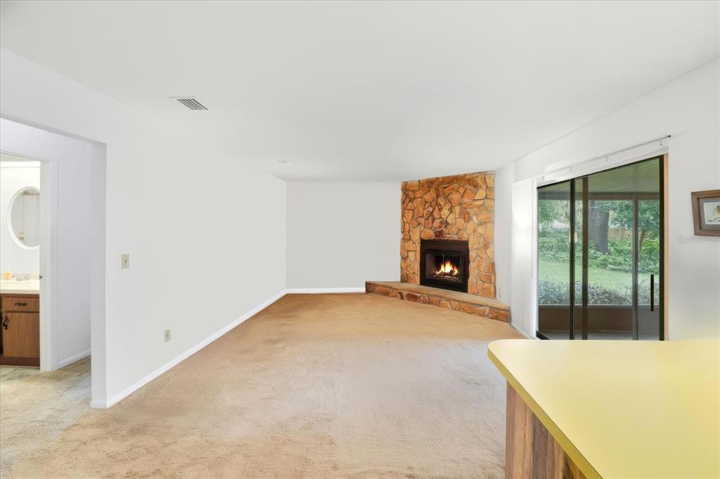 3103 South Bay Berry Point Inverness, FL 34450 - Photo 24 of 50 a view of an empty room with a fireplace