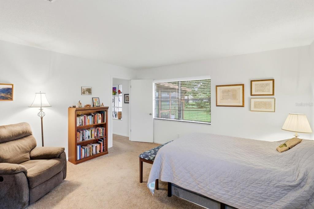 3103 South Bay Berry Point Inverness, FL 34450 - Photo 26 of 50 a bed room with a bed and a book shelf