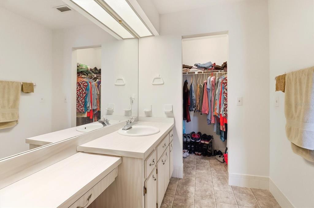 3103 South Bay Berry Point Inverness, FL 34450 - Photo 28 of 50 a bathroom with a sink vanity and a mirror