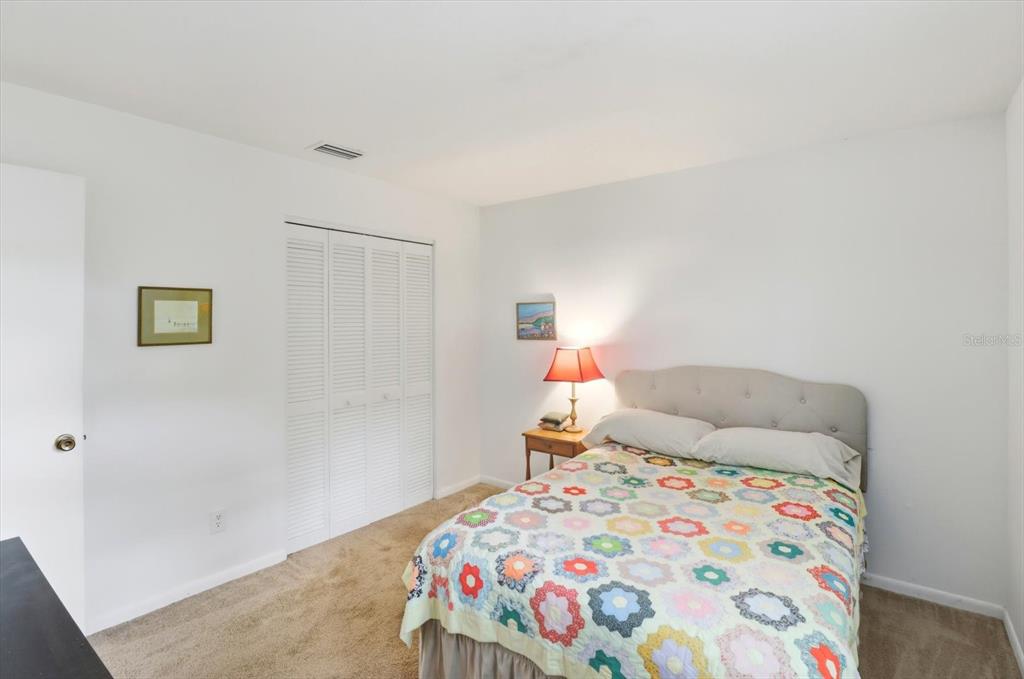 3103 South Bay Berry Point Inverness, FL 34450 - Photo 30 of 50 a bedroom with a bed and a dresser in it
