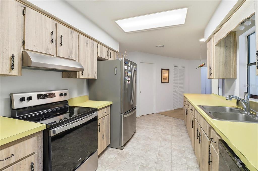 3103 South Bay Berry Point Inverness, FL 34450 - Photo 3 of 50 a kitchen with a stove sink and refrigerator
