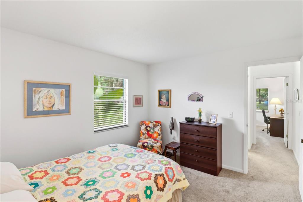 3103 South Bay Berry Point Inverness, FL 34450 - Photo 31 of 50 a bedroom with a bed and dresser with mirror