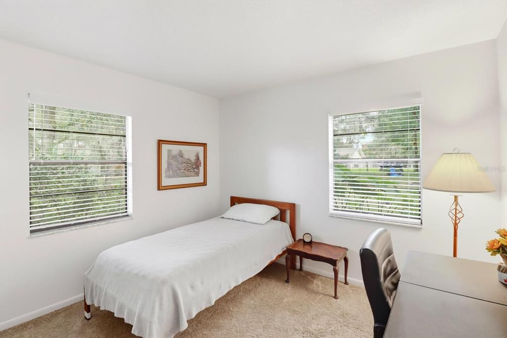 3103 South Bay Berry Point Inverness, FL 34450 - Photo 34 of 50 a bedroom with a bed and a chair