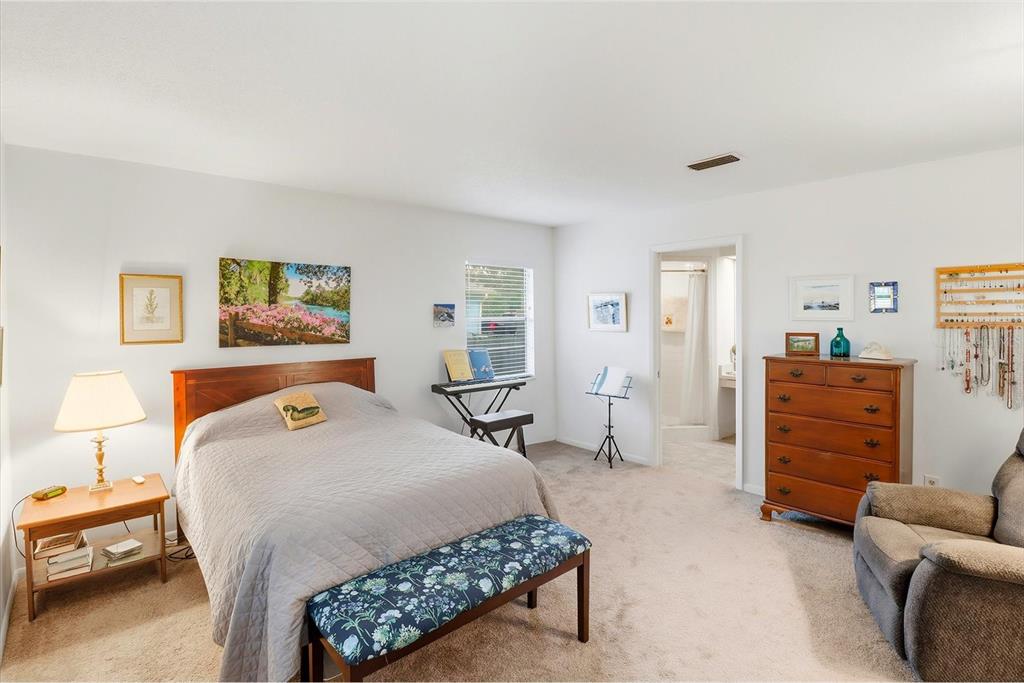 3103 South Bay Berry Point Inverness, FL 34450 - Photo 5 of 50 a bedroom with a bed and wooden floor