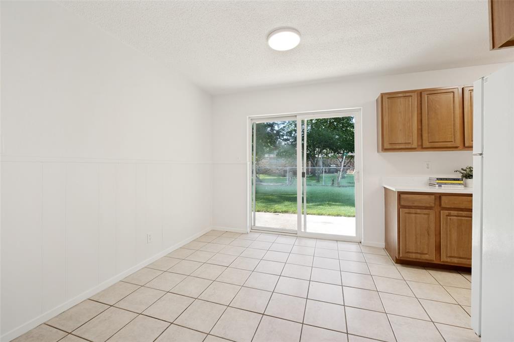 709 East Main Street Pilot Point, TX 76258 - Photo 4 of 11 a view of an empty room with window and cabinet