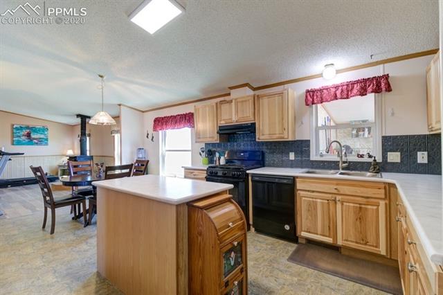 5705 South Yoder Road Yoder, CO 80864 - Photo 16 of 42 Kitchen and dining area