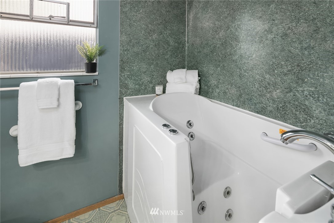 203 Northwest 4th Street Renton, WA 98057 - Photo 18 of 27 a bathroom with a bathtub and shower