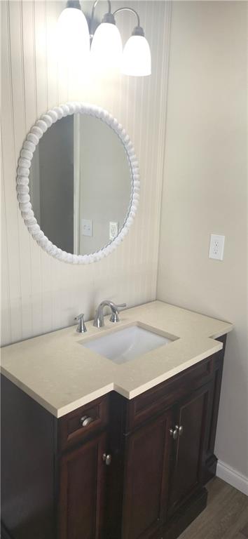 11013 Clearwater Drive Hampton, GA 30228 - Photo 19 of 23 a bathroom with a sink vanity and a mirror