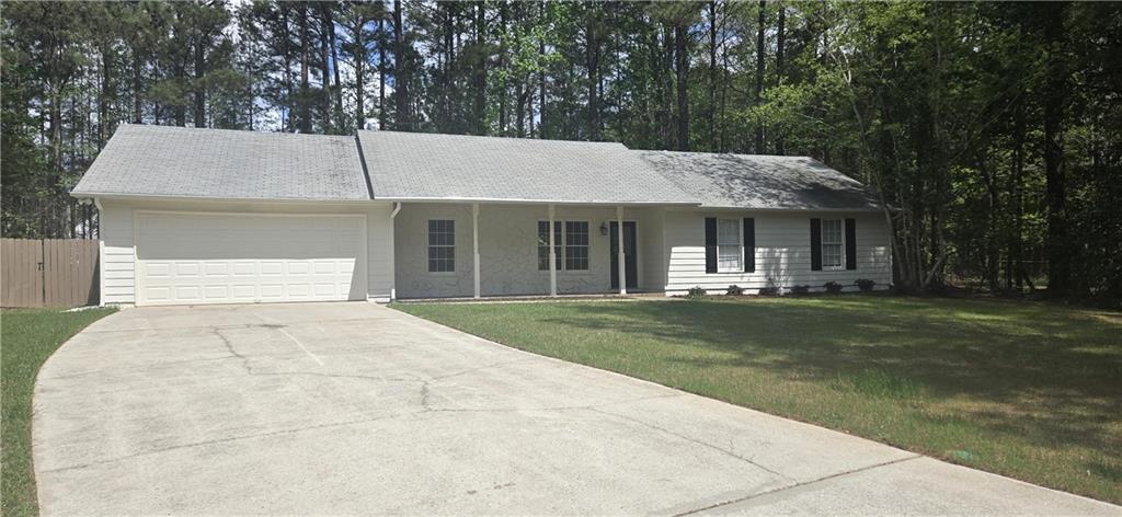11013 Clearwater Drive Hampton, GA 30228 - Photo 5 of 23 a front view of a house with a garden