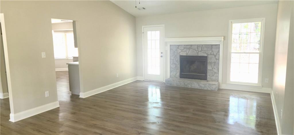 11013 Clearwater Drive Hampton, GA 30228 - Photo 6 of 23 a view of an empty room with wooden floor and a window