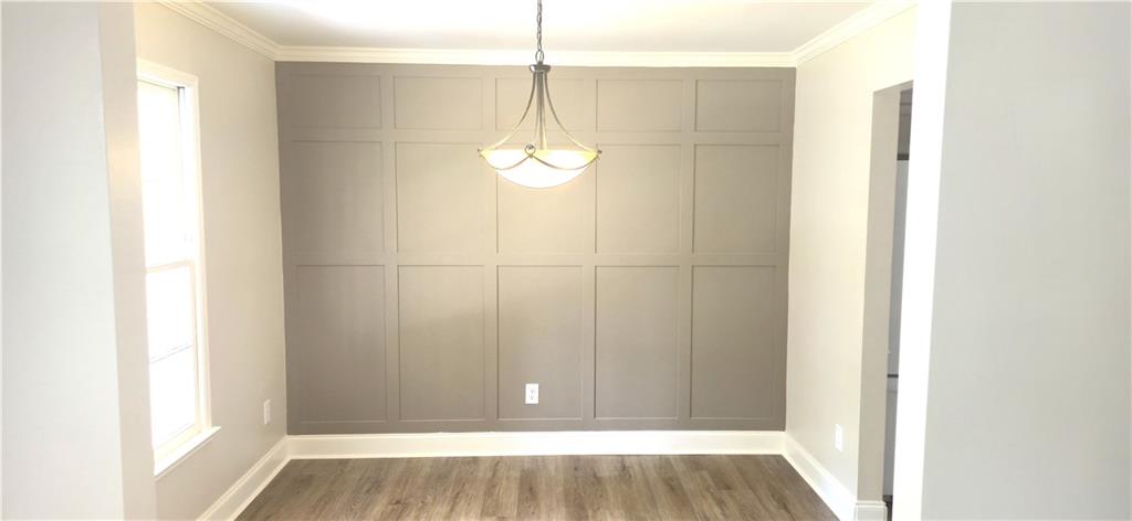 11013 Clearwater Drive Hampton, GA 30228 - Photo 10 of 23 a view of a room with wooden floor and windows