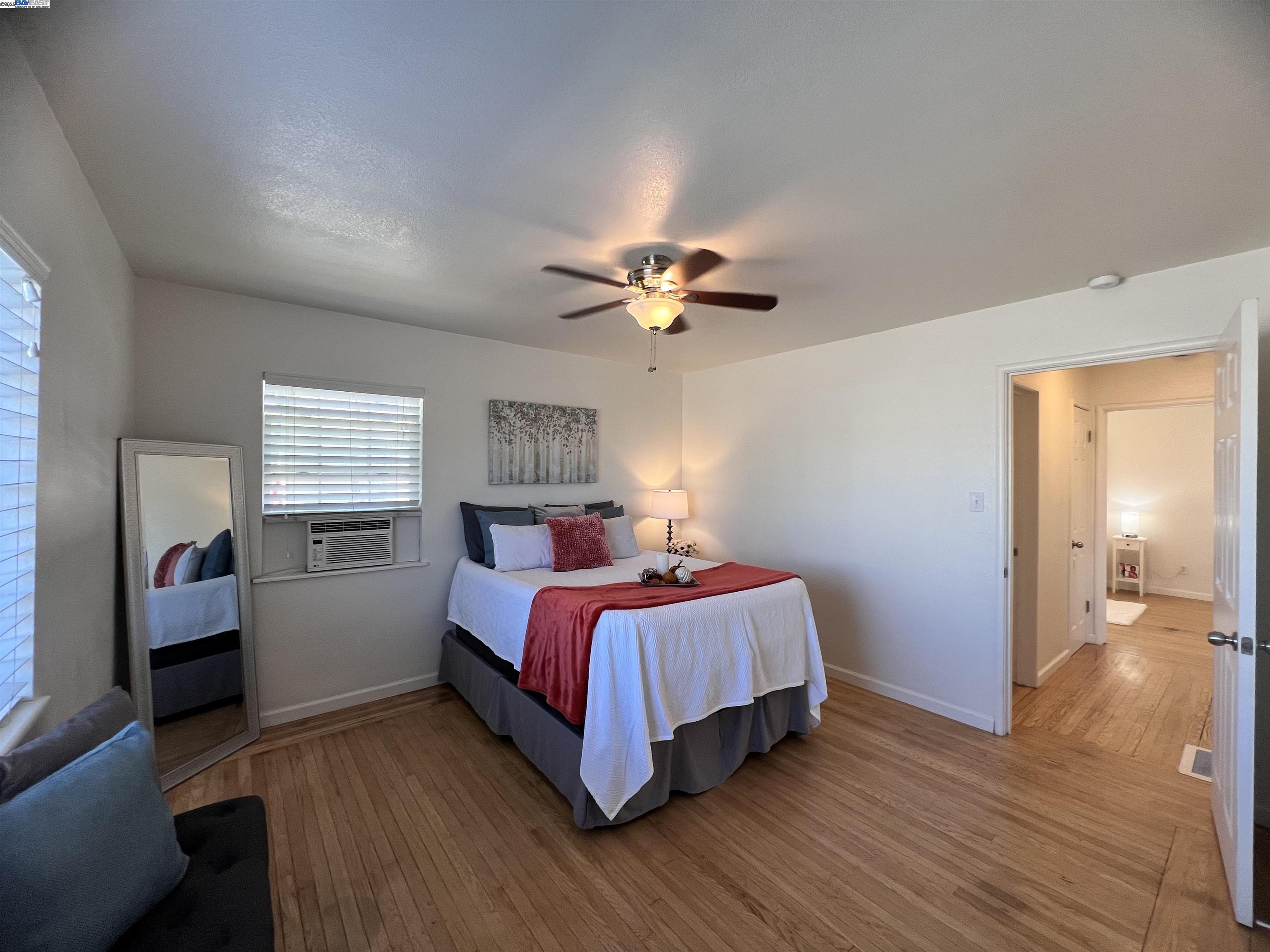 1727 Second Street Livermore, CA 94550 - Photo 15 of 24 a bed room with a bed and a ceiling fan