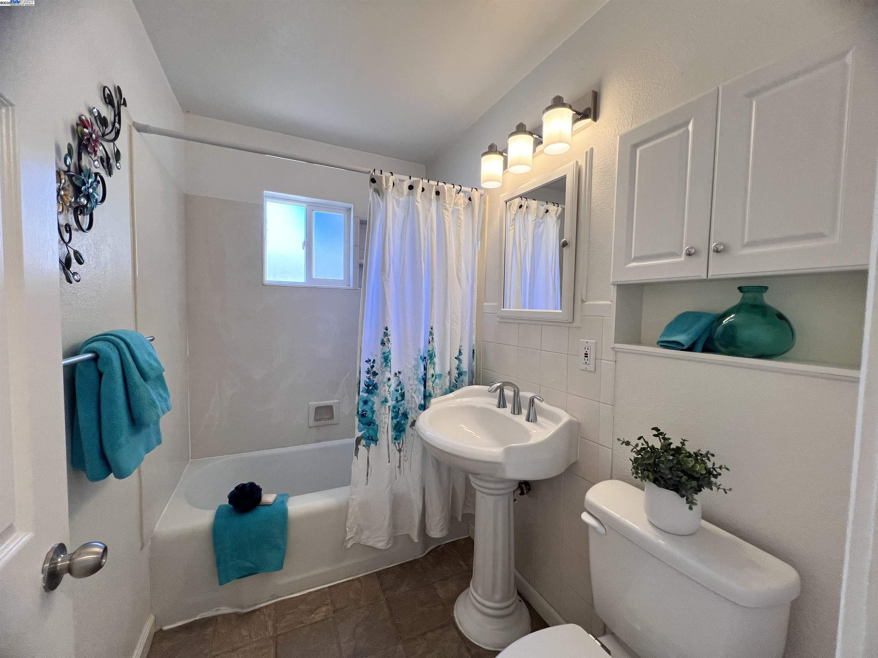 1727 Second Street Livermore, CA 94550 - Photo 16 of 24 a bathroom with a toilet sink and mirror
