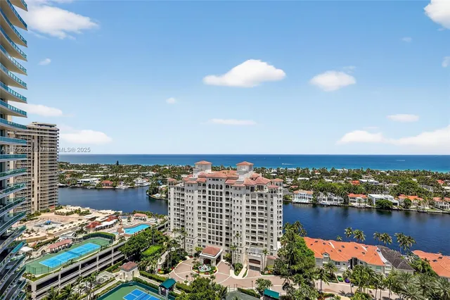 a view of a house with a cars park front of a house