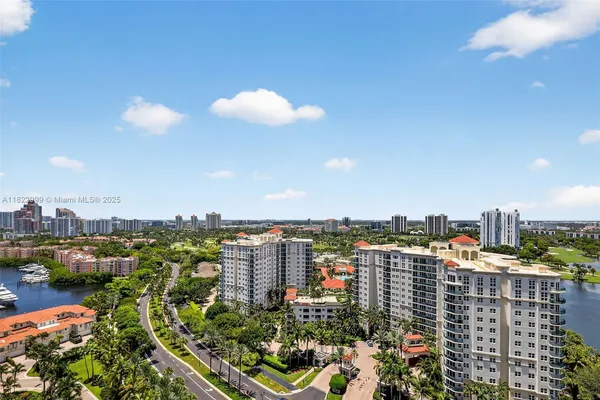 a bed sitting in a spacious bedroom next to a window