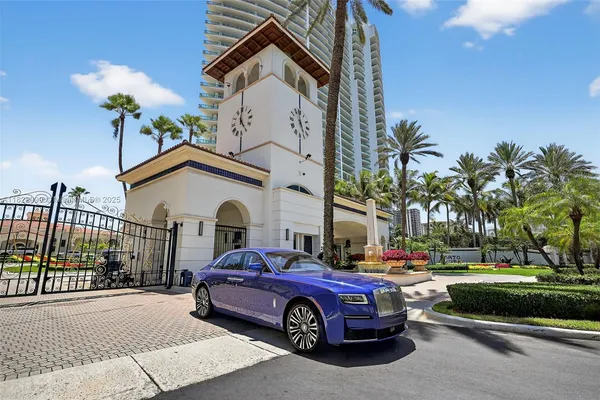 a living room with furniture and large window