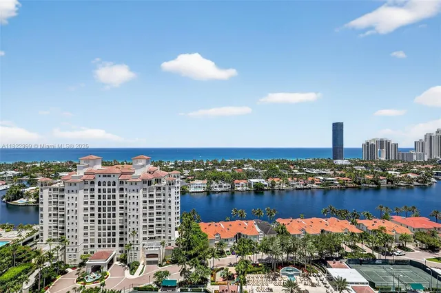 a bedroom with a bed and glass door
