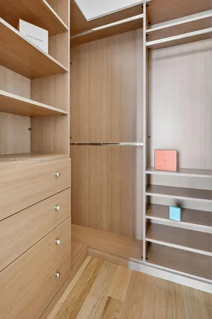 a view of living room with furniture and a chandelier