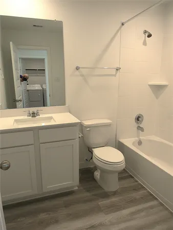 a bathroom with a sink and toilet