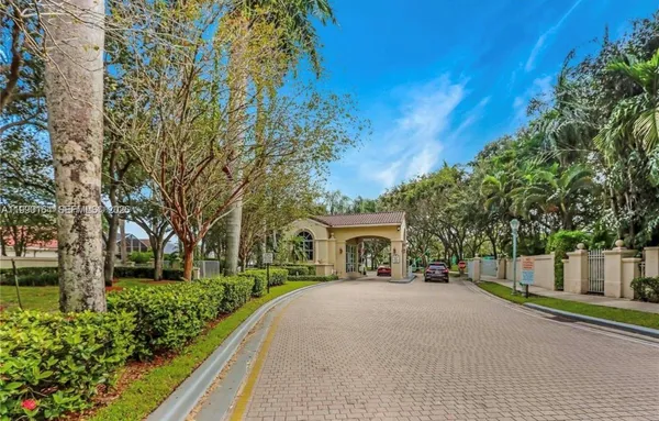 a view of house with outdoor space and trees
