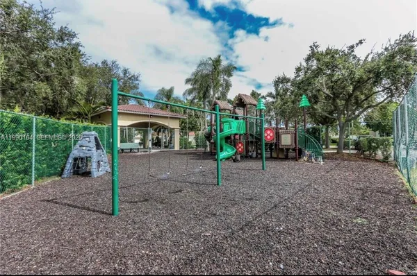 a view of outdoor space with deck and trees