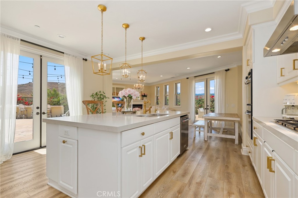 1 David Street Ladera Ranch, CA 92694 - Photo 12 of 66 a large kitchen with kitchen island a large counter space a sink stainless steel appliances and cabinets