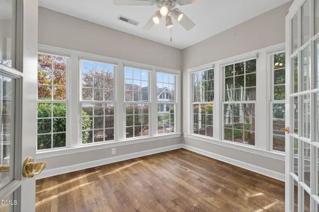 a view of an empty room with a window and balcony