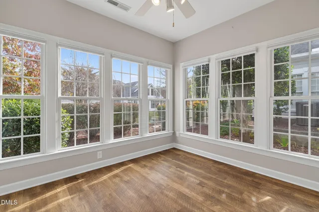 a view of entryway with wooden floor and door