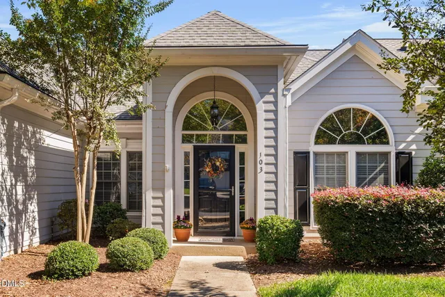 a front view of a house with garden