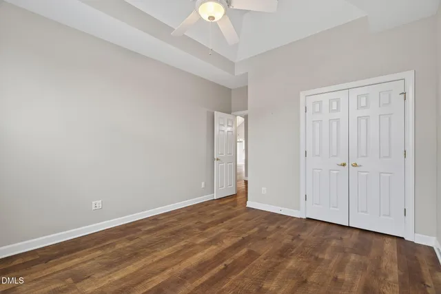 a view of a room with wooden floor