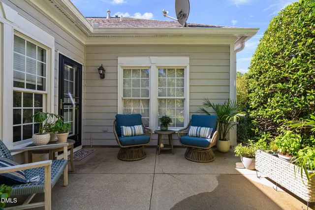 a view of a yard with plants and trees