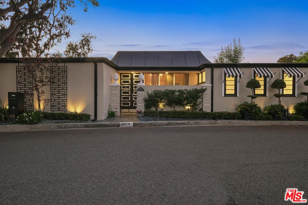 2019 Stradella Road Los Angeles, CA 90077 - Photo 1 of 45 front view of a house with a street