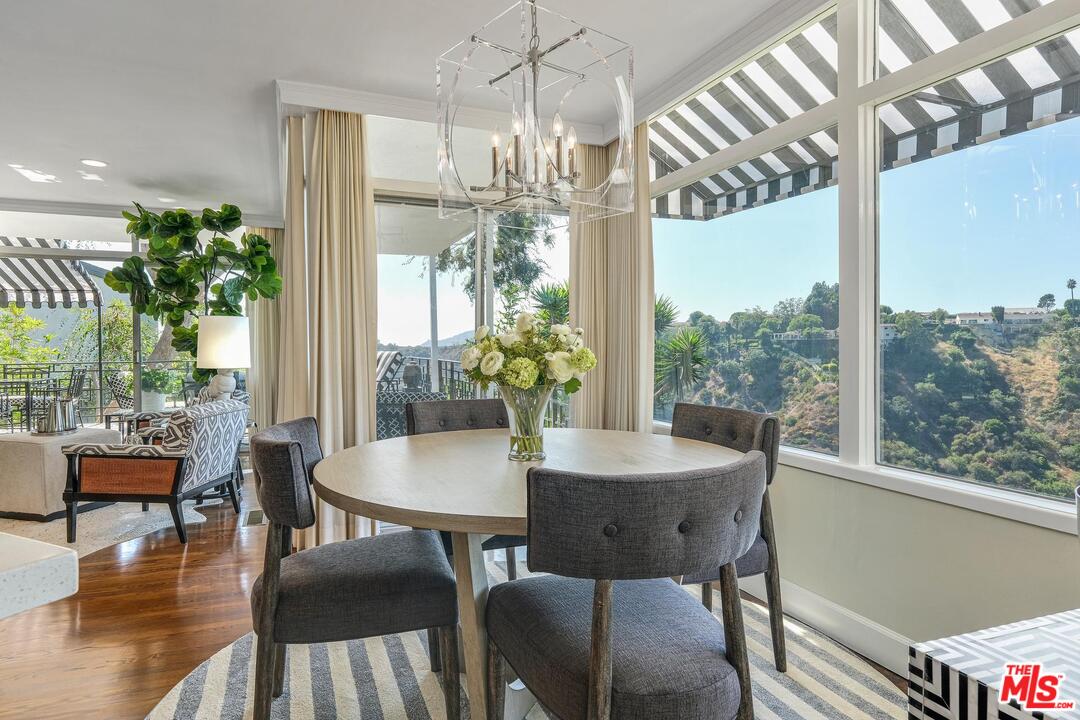 2019 Stradella Road Los Angeles, CA 90077 - Photo 12 of 45 a view of a dining room with furniture window and wooden floor