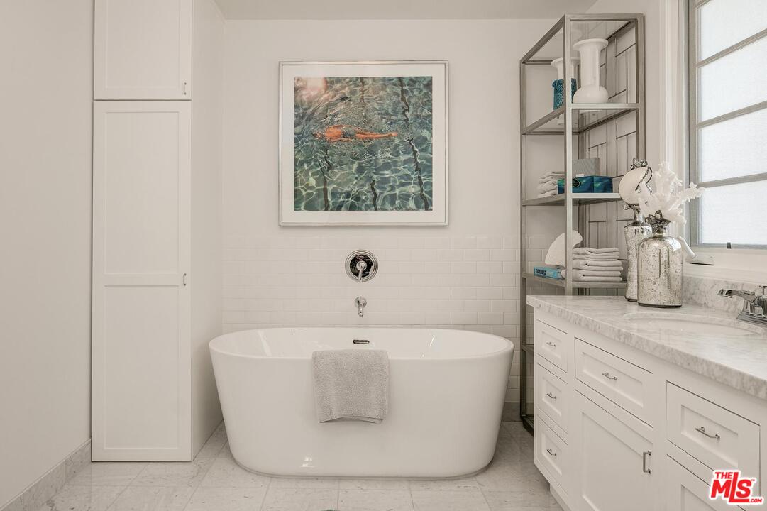 2019 Stradella Road Los Angeles, CA 90077 - Photo 18 of 45 a white bath tub sitting next to a white sink