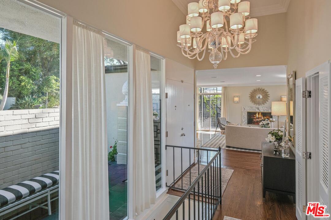 2019 Stradella Road Los Angeles, CA 90077 - Photo 3 of 45 a view of a balcony and dining area