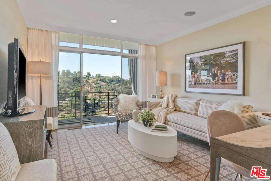 2019 Stradella Road Los Angeles, CA 90077 - Photo 22 of 45 a living room with furniture and a large window