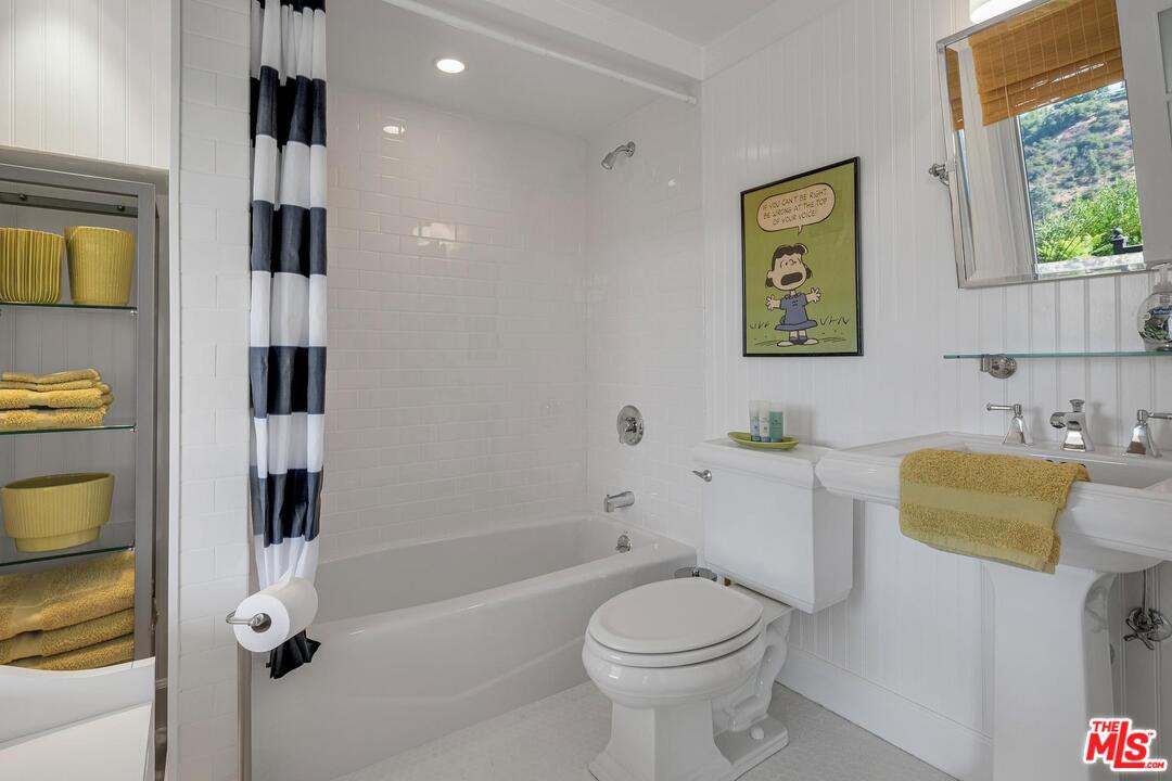 2019 Stradella Road Los Angeles, CA 90077 - Photo 28 of 45 a bathroom with a sink a toilet and shower
