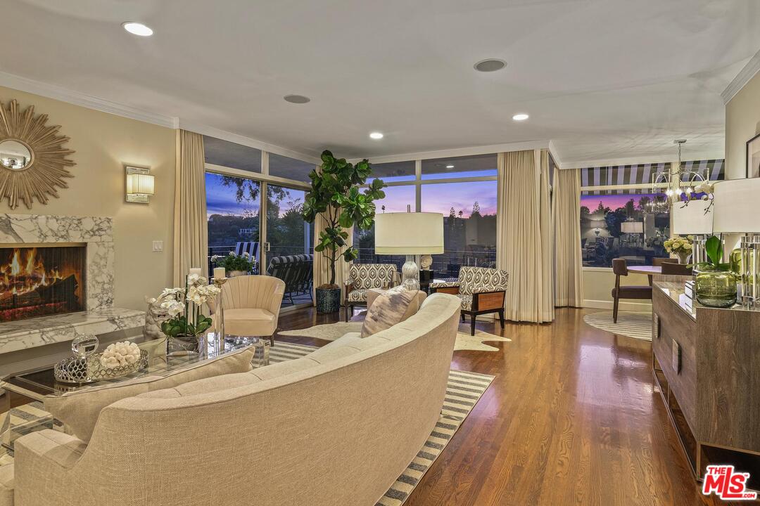 2019 Stradella Road Los Angeles, CA 90077 - Photo 35 of 45 a view of living room filled with furniture and a flat screen tv