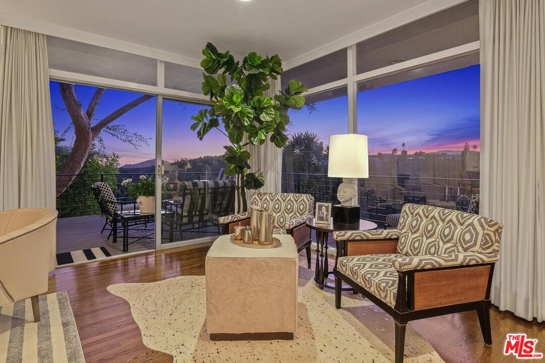 2019 Stradella Road Los Angeles, CA 90077 - Photo 36 of 45 a living room with furniture a lamp and a potted plant