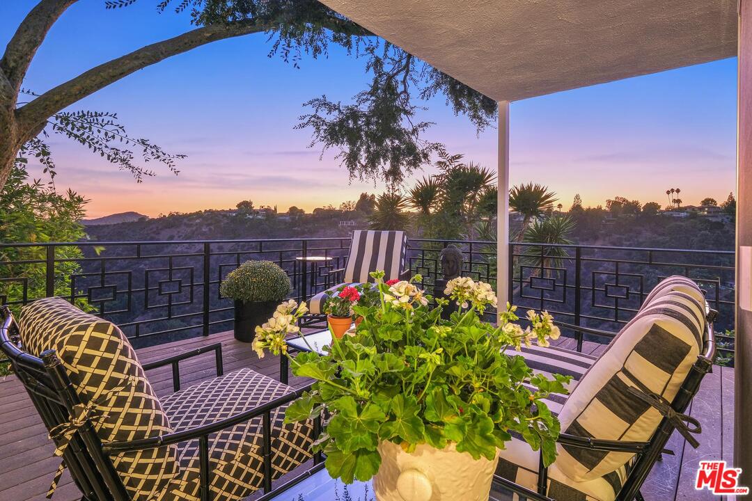 2019 Stradella Road Los Angeles, CA 90077 - Photo 39 of 45 a view of a chairs and table in the patio