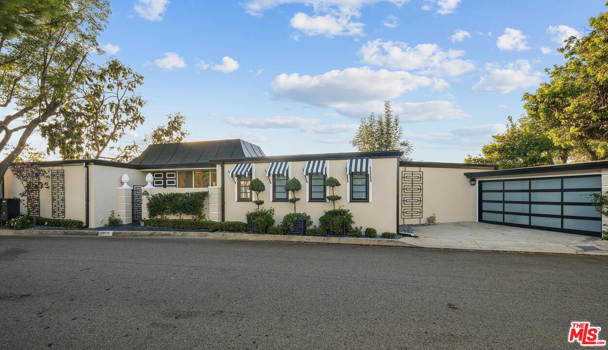 2019 Stradella Road Los Angeles, CA 90077 - Photo 41 of 45 a view of a house with a street
