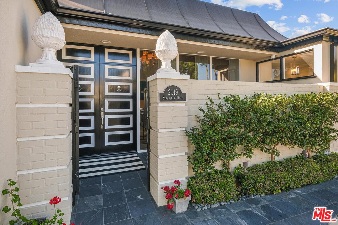 2019 Stradella Road Los Angeles, CA 90077 - Photo 43 of 45 a front view of a house with entryway