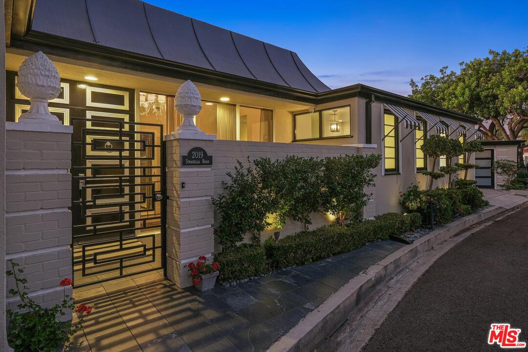 2019 Stradella Road Los Angeles, CA 90077 - Photo 44 of 45 a front view of a house with a yard