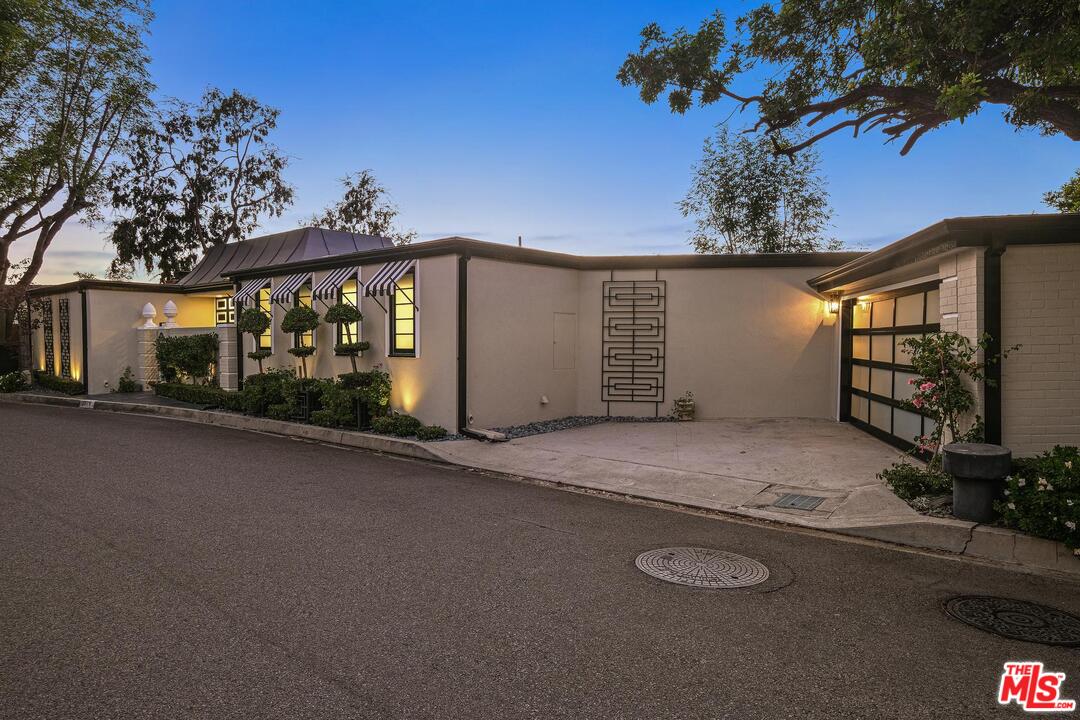 2019 Stradella Road Los Angeles, CA 90077 - Photo 45 of 45 a front view of a house with garden