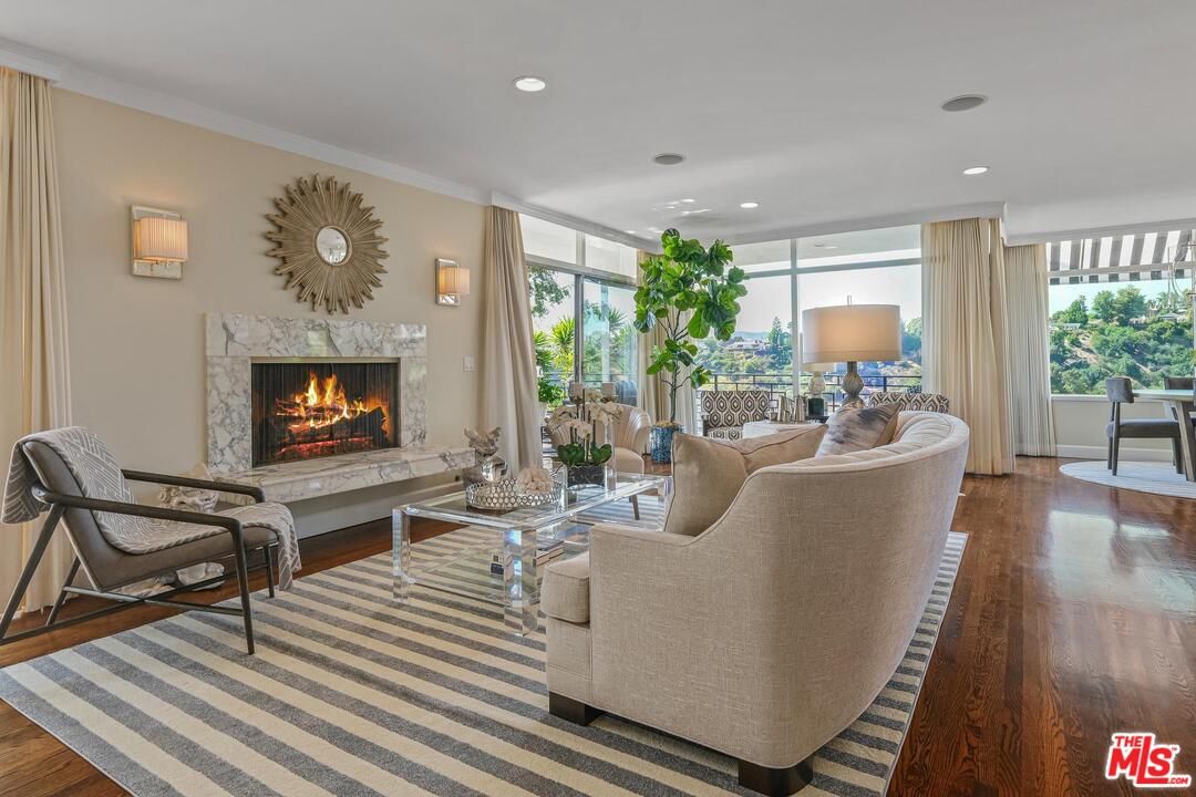 2019 Stradella Road Los Angeles, CA 90077 - Photo 6 of 45 a living room with furniture and a fireplace