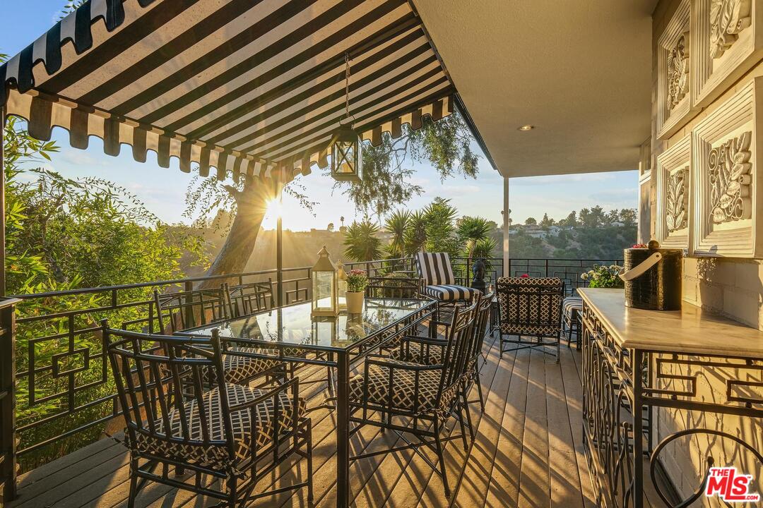 2019 Stradella Road Los Angeles, CA 90077 - Photo 9 of 45 a view of a chairs and table in the patio