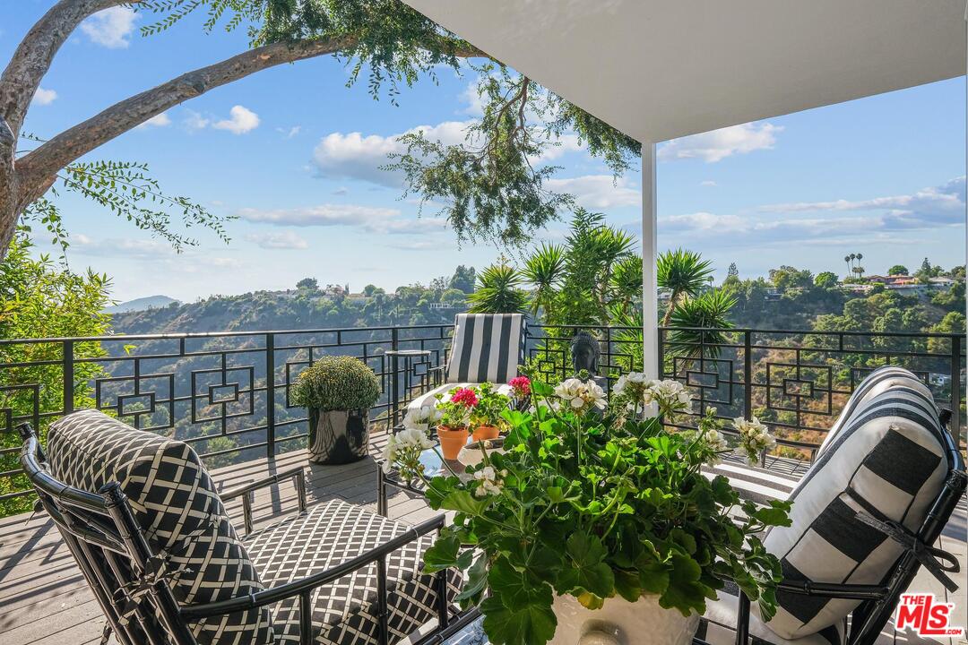 2019 Stradella Road Los Angeles, CA 90077 - Photo 10 of 45 a view of a chairs and table in the balcony