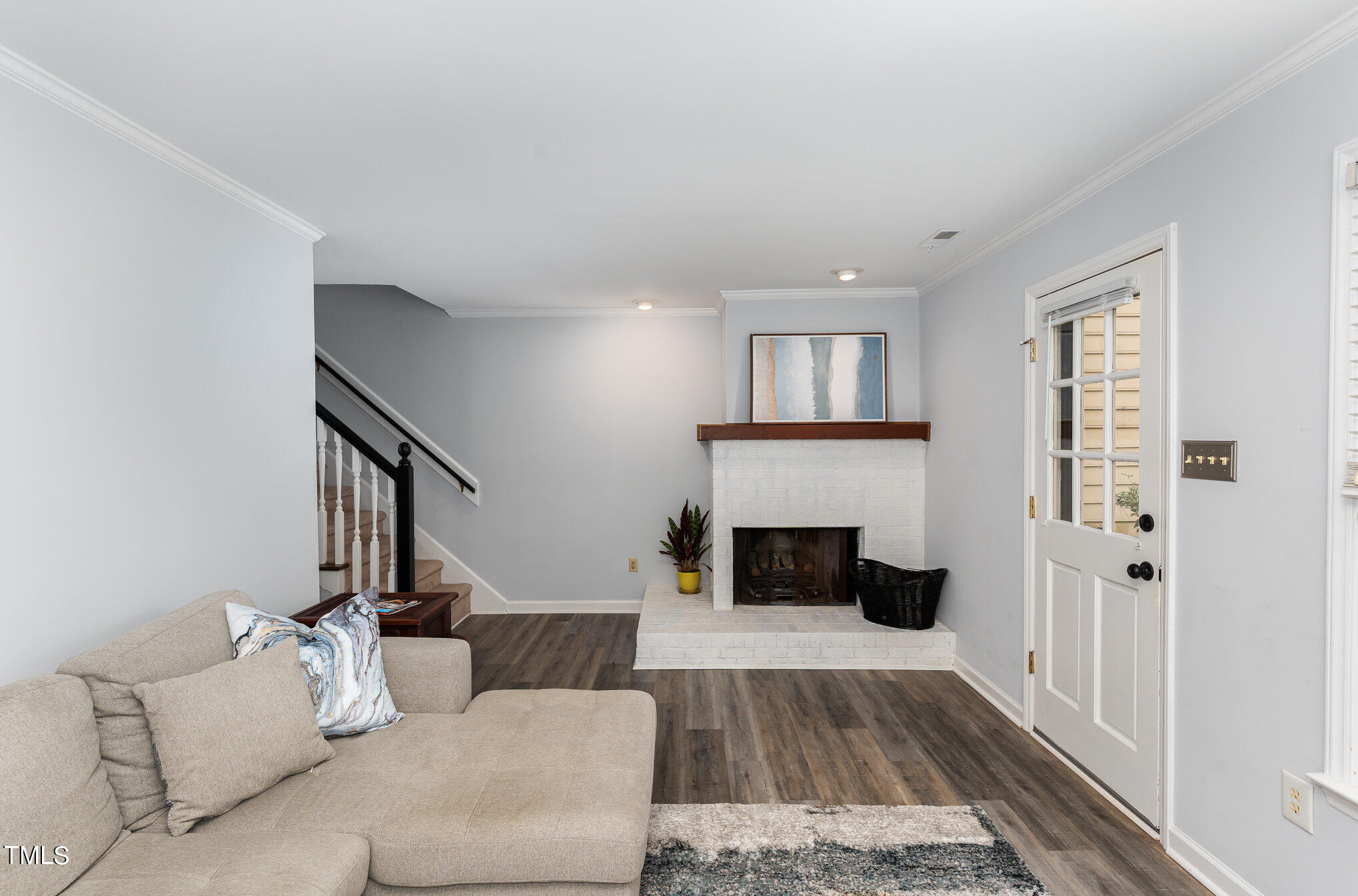 5515 Hamstead Crossing Raleigh, NC 27612 - Photo 5 of 17 a living room with furniture and a fireplace