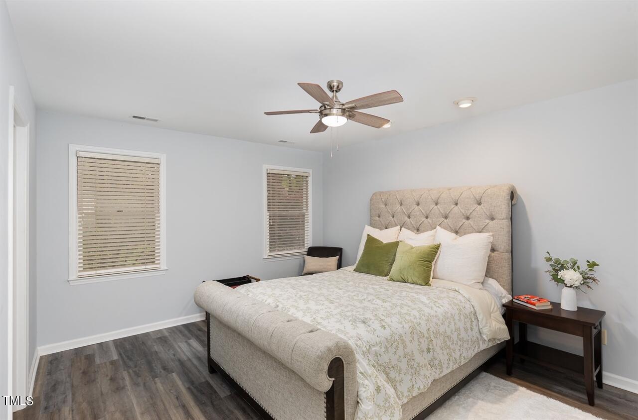 5515 Hamstead Crossing Raleigh, NC 27612 - Photo 9 of 17 a bedroom with a large bed and a window